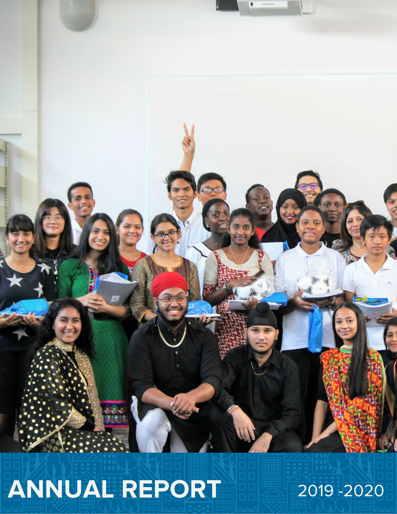Group of young people smiling at the cameral. Text reads Annual Report 2019 - 2020