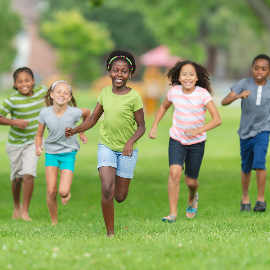 Children running on grass.