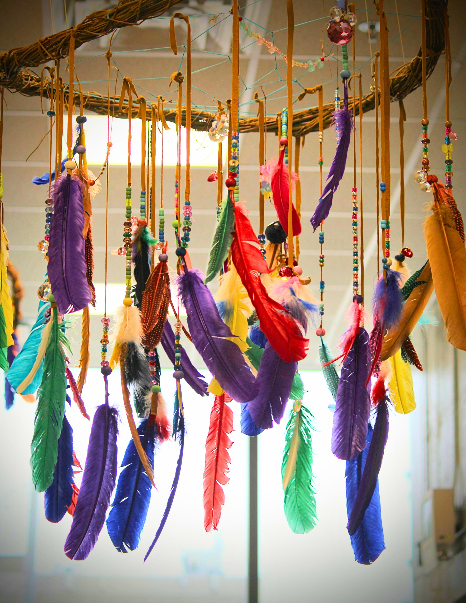 A dreamcatcher with colourful feathers
