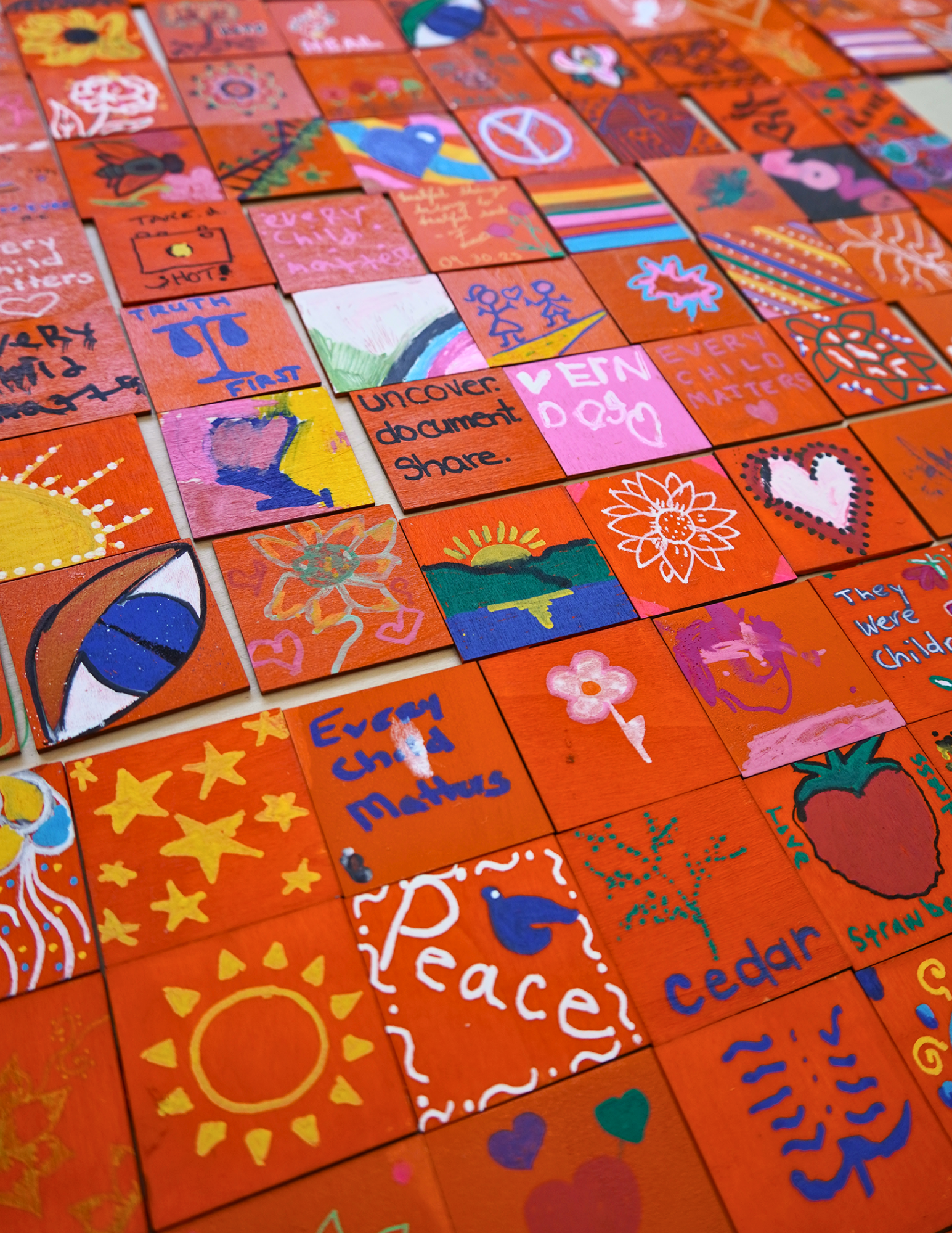 Painted Orange Tiles with messages.